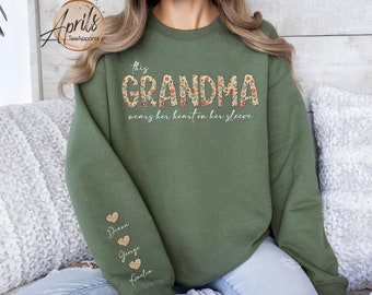 Custom This Grandma Wears Her Heart On Her Sleeve Sweatshirt, Shirt with Names On Sleeve, Mommy Heart Hoodie, Mother's Day Gift