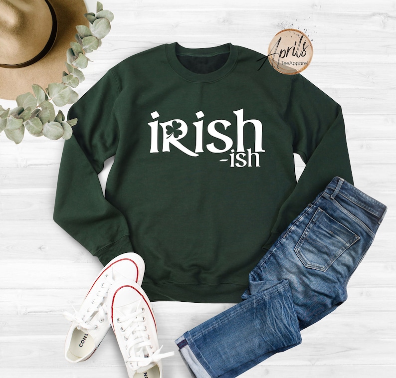 May include: A dark green sweatshirt with the text "irish-ish" in white with a shamrock graphic.