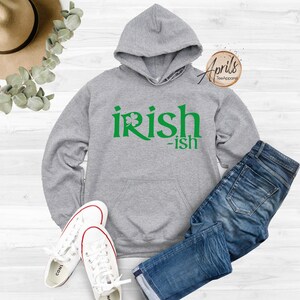 May include: Gray hooded sweatshirt with a green shamrock and the text "irish-ish" printed on the front.