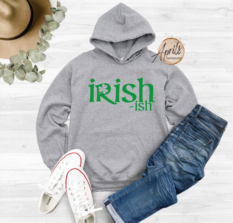 May include: Gray hooded sweatshirt with a green shamrock and the text "irish-ish" printed on the front.
