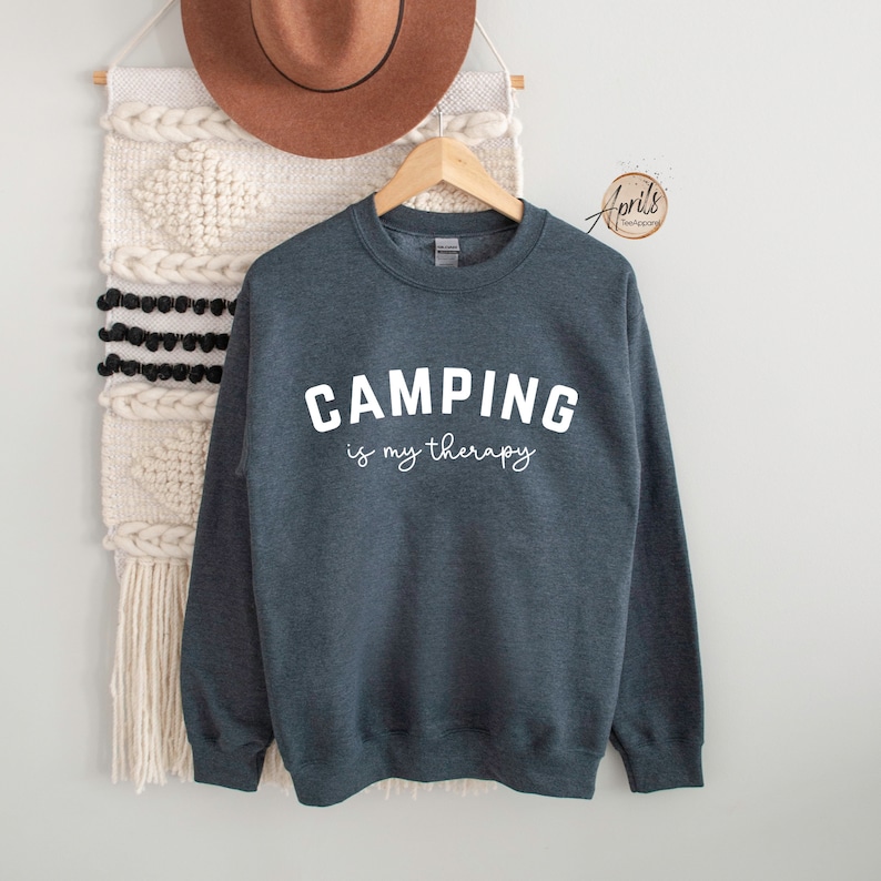 May include: A dark heather gray sweatshirt with the text "CAMPING is my therapy" in white.