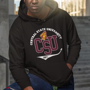 May include: Black hooded sweatshirt with a white and maroon graphic of the Central State University logo. The logo features the text "Central State University" and "CSU" in a maroon circle with a white outline. The year "1887" is printed below the logo.