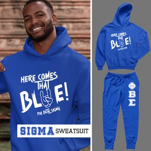 May include: Royal blue Sigma sweatsuit set. The set includes a hooded sweatshirt and matching sweatpants. The sweatshirt features the text "HERE COMES THAT BLUE!" in white, along with a hand gesture and the Greek letters Phi Beta Sigma. The sweatpants have the Greek letters Phi, Beta, and Sigma.