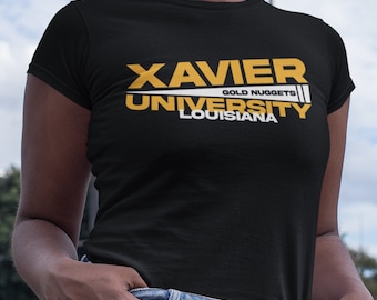 May include: Black t-shirt with a white and gold graphic that says "XAVIER UNIVERSITY GOLD NUGGETS LOUISIANA"
