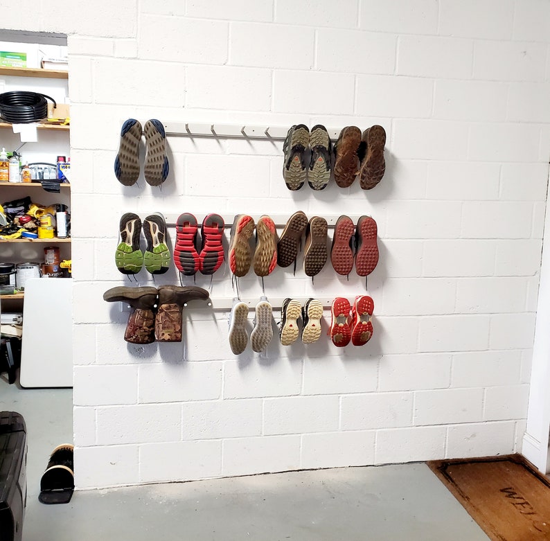 Shoe Rack. Wall Shoe Storage. 4 lengths, holds 2 pairs 5 pairs. Easy install. Hardware included. Free Shipping. Space Saver. Etsy's Pick. 48" - holds 5 pairs