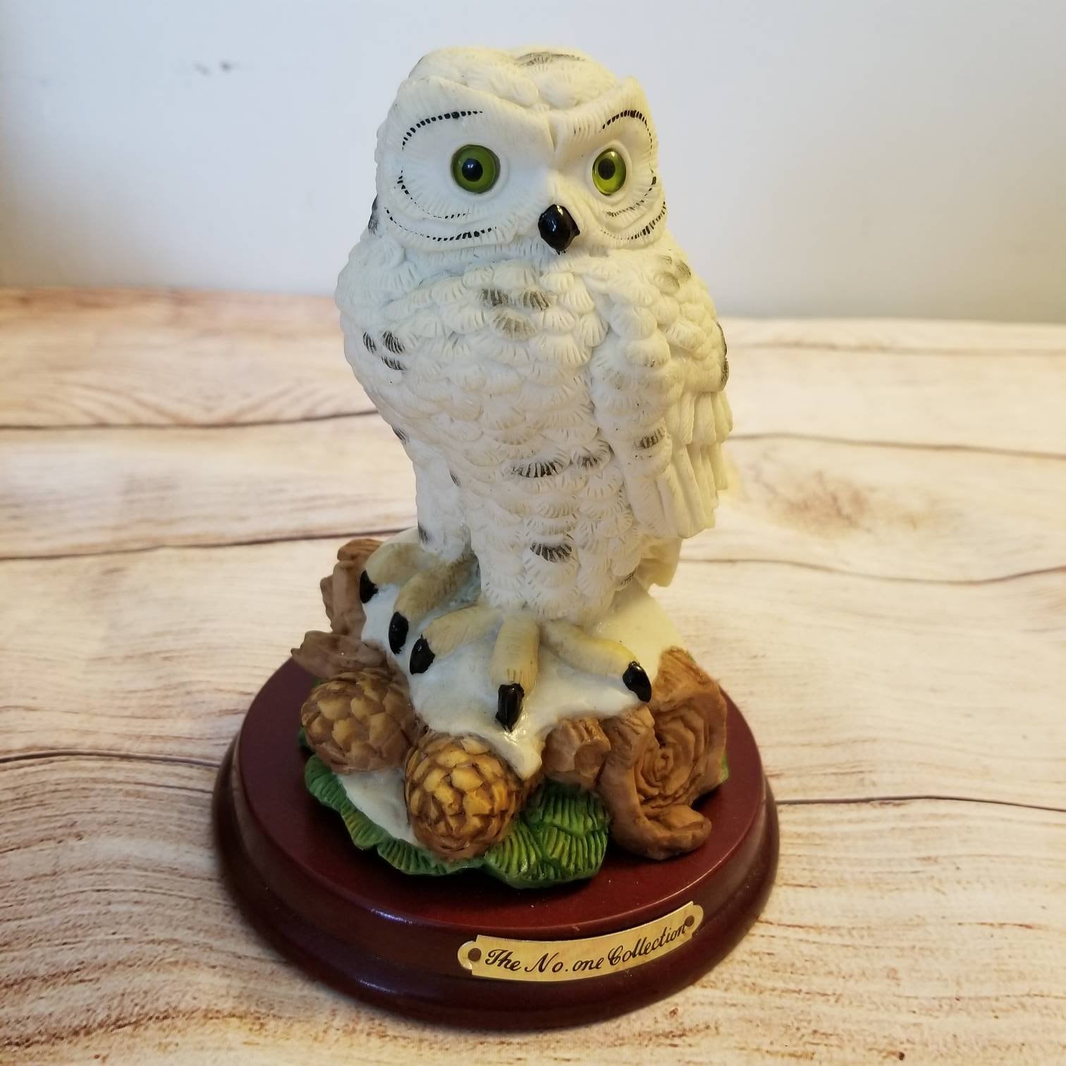 Vintage Snowy Owl on wooden pedestal byNo One Collection