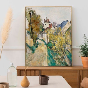 K&ouml;nnte beinhalten: Ein Gem&auml;lde einer Dorfstra&szlig;e mit H&auml;usern und B&auml;umen. Die H&auml;user sind in Wei&szlig;-, Gelb- und Rott&ouml;nen gemalt. Die B&auml;ume sind in Gr&uuml;n- und Gelbt&ouml;nen gemalt. Die Stra&szlig;e ist in Braun- und Gelbt&ouml;nen gemalt.