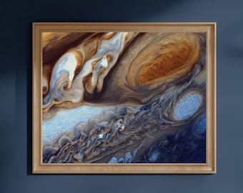 May include: A rectangular wall art print featuring a high-resolution image of Jupiter's swirling atmosphere, showcasing shades of deep blue, tan, brown, and white, encased in a simple light-toned wooden frame with a clean, flat profile.