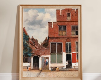 May include: A framed oil painting depicting a Dutch courtyard scene with red brick buildings, green shutters, and a cobblestone ground. Figures are visible near doorways under a cloudy sky, with a climbing vine on the left wall and a wooden frame.