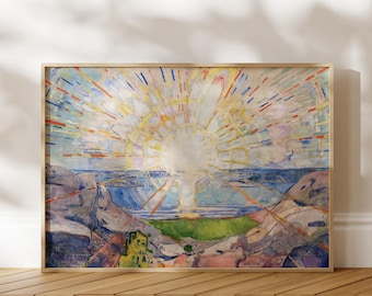 May include: A rectangular framed print featuring an impressionist painting of a bright sunburst over a coastal landscape. The scene displays a central white sun with radiating yellow, orange, and blue light rays above a blue sea and rocky terrain.