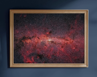 May include: A rectangular wall art print featuring a deep space nebula with vibrant red and dark purple gaseous clouds, scattered white stars, and cosmic dust, encased in a simple light-toned wooden frame with a clean, flat profile.