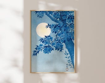 May include: A rectangular wall art print in a wooden frame featuring a blue monochromatic illustration of a tree branch with blossoms against a pale blue background and a large, circular, off-white moon, with Japanese text in the corner.