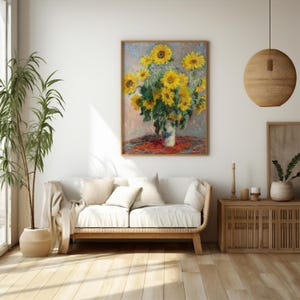 a painting of sunflowers in a vase on a white couch