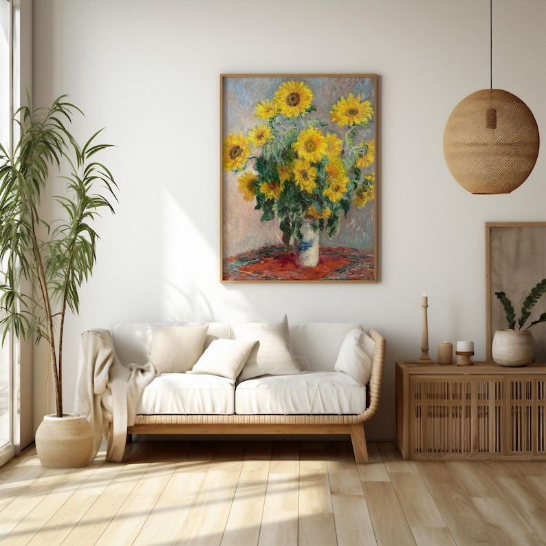 a painting of sunflowers in a vase on a white couch