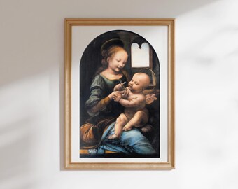 May include: A framed print featuring a classical painting of a woman in a dark green dress holding a baby on her lap. The scene is set within an arched frame, showing the figures in soft lighting against a dark background with a window.