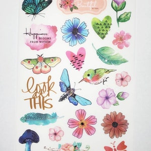 May include: A sheet of colorful stickers featuring butterflies, flowers, birds, hearts, and leaves. The stickers have a watercolor-like design and include the text "Happiness blooms from within" and "Look at this".