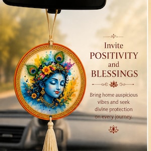 May include: A round car hanging ornament featuring a colorful illustration of a blue-skinned deity with peacock feathers and flowers. The text reads: Invite POSITIVITY and BLESSINGS. Bring home auspicious vibes and seek divine protection on every journey.