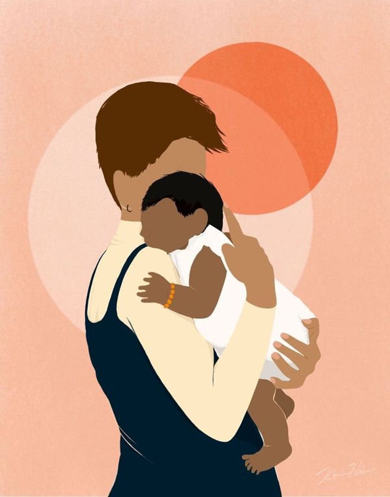 May include: A woman with short brown hair is holding a baby in her arms. The baby is wearing a white onesie and has dark skin. The woman is wearing a dark blue sleeveless dress. The background is a soft pink with two large orange circles.