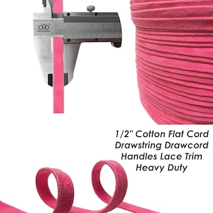 May include: A spool of pink 1/2 inch cotton flat cord, also known as drawstring or drawcord. This heavy duty cord is ideal for crafting, sewing, and DIY projects.