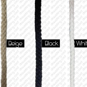 May include: Three spools of cord in beige, black, and white. The cord is braided and appears to be cotton.