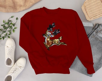 red sweater with gold sequin reindeer
