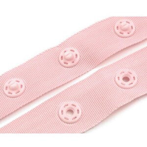 May include: Pink fabric ribbon with plastic snap buttons. The ribbon is folded in half, showing the buttons on both sides.