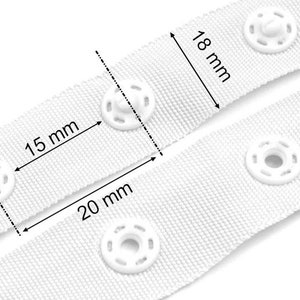May include: White fabric tape with white plastic snap buttons. The tape is 18 mm wide and the buttons are spaced 15 mm apart. The buttons are 20 mm in diameter.