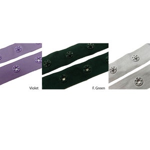 May include: Three strips of fabric with buttonholes and buttons. The fabric is in three colors: violet, forest green, and gray.