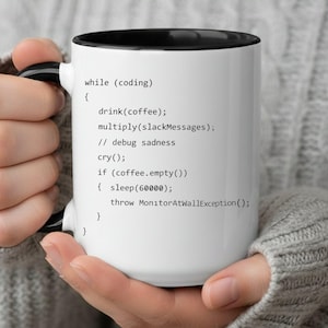 May include: White ceramic mug with a black interior and handle. The mug features programming code text: "while (coding) { drink(coffee); multiply(slackMessages); // debug sadness cry(); if (coffee.empty()) { sleep(60000); throw MonitorAtWallException(); } }"