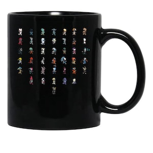 May include: Black ceramic coffee mug featuring a grid of colorful pixelated character designs. The characters are diverse in appearance, with various outfits and poses. The mug has a curved handle and a glossy finish, suitable for hot beverages.
