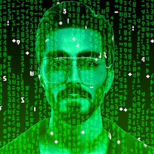 May include: A man's face is superimposed over a green digital background with a matrix-style code. The man is wearing glasses and has a beard.