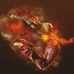 May include: A person in mid-air, surrounded by flames and smoke. The person is wearing jeans and a green shirt. The flames are orange and red, and the smoke is white and gray.