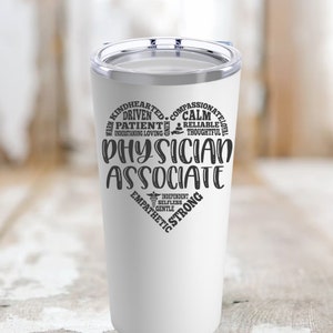 May include: White insulated tumbler with a clear lid. The tumbler features a heart-shaped design with the words "Physician Associate" in the center, surrounded by positive attributes like "Kindhearted" and "Compassionate."