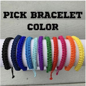 May include: A selection of 10 colorful braided bracelets in black, navy blue, turquoise, light blue, mint green, purple, green, red, pink, and orange.  Pick your bracelet color.