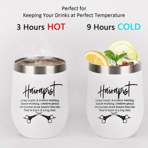 May include: Two white stainless steel tumblers with black text that reads "Hairapist (n) hair-a-pist: A scissor wielding, miracle working, creative genius who touches more hearts than hair. They're kind of a big deal."  Each tumbler has a pair of crossed scissors. One tumbler has a brown liquid inside and the other has a lemon wedge and mint leaves inside.
