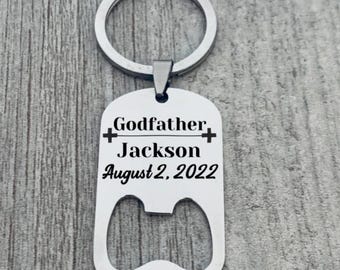 May include: Silver bottle opener keychain with the text "Godfather Jackson August 2, 2022" engraved on it.