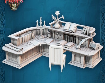 May include: A 3D printable L-shaped desk set with a chair, featuring books, scrolls, a candelabra, a flower vase, and a quill. The text 3D PRINTABLE FANTASY PROPS 2 is visible in the upper left corner of this light gray miniature model.