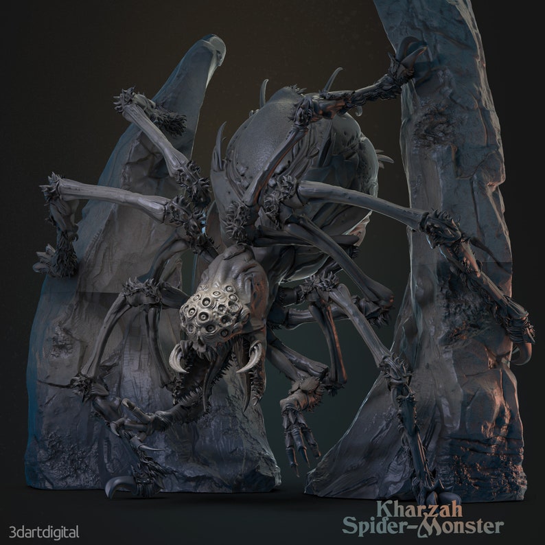 May include: A detailed, grey, 3D printed model of a spider monster with multiple eyes and sharp fangs. The spider is posed on a rocky base, with its legs outstretched. The text "Kharzah Spider-Monster" is printed on the base.