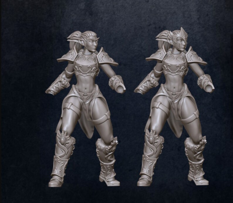 Puede incluir: Dos figuras en miniatura grises y detalladas de elfos femeninos con armadura y armas. Las figuras est&aacute;n en una postura din&aacute;mica, listas para la batalla.