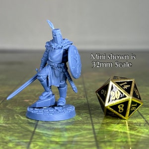 May include: A blue plastic miniature of a knight in armor holding a sword and shield. The miniature is standing on a round base. The miniature is 32mm in scale. Mini shown is 32mm Scale.