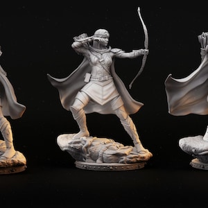May include: A gray 3D printed figurine of a female archer with a bow and arrow, wearing a cloak and armor, standing on a rocky base.