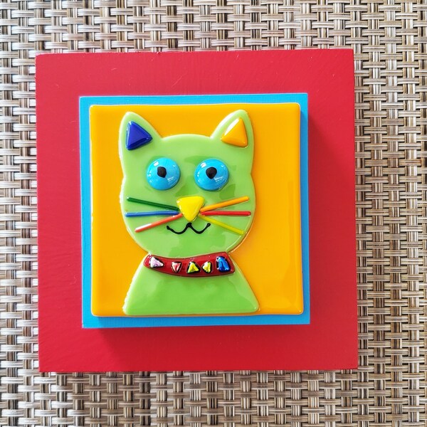 Fused glass green cat with features on orange  glass and  red frame  cat wall art  by Gary Levin Glass #GaryLevinGlass