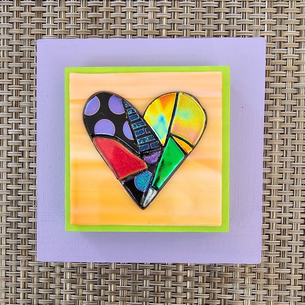 framed multicolored Heart fused dichroic glass on orange glass and purple frame  wall art  by Gary Levin Glass #GaryLevinGlass