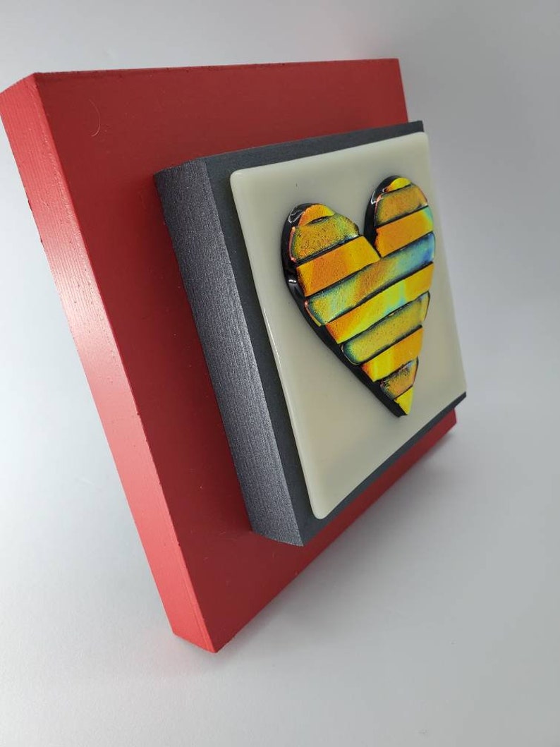 Red Gold colored fused dichroic glass heart on off white glass and red frame wall art by Gary Levin Glass