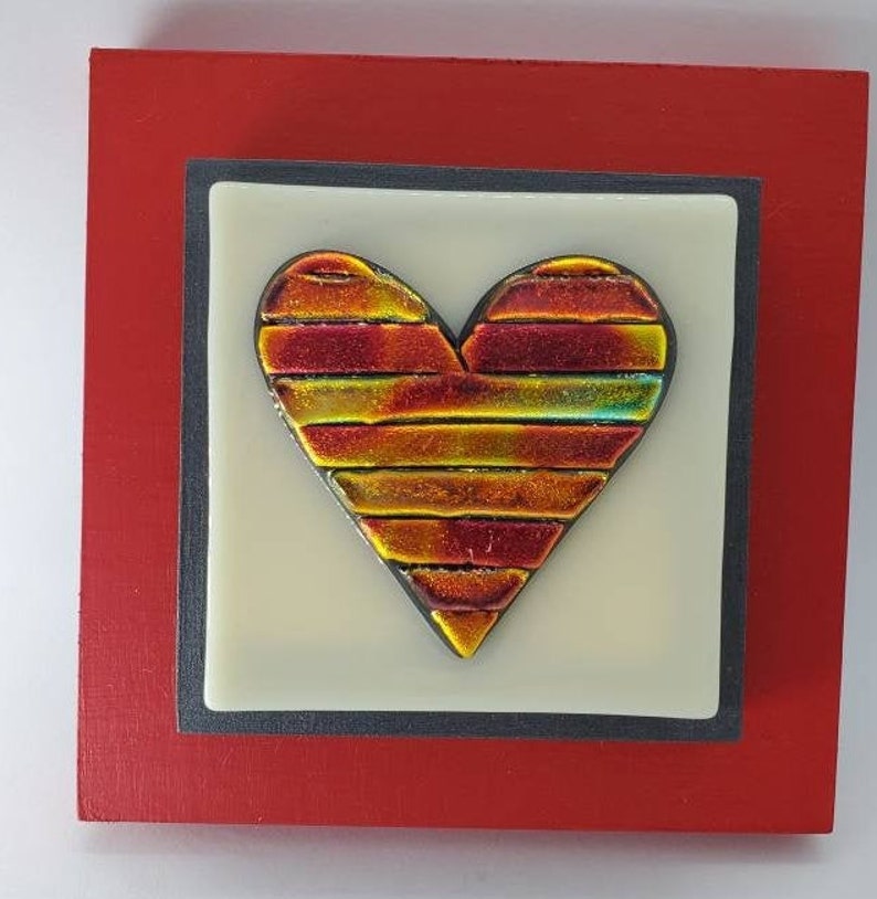 Red Gold colored fused dichroic glass heart on off white glass and red frame wall art by Gary Levin Glass