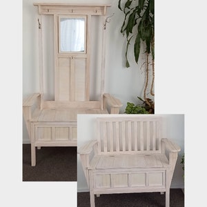 May include: White wooden hall tree with a bench and storage compartment. The hall tree has a mirror and hooks for hanging coats. The bench has a hinged lid for storage.