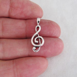 Sterling Silver 21mm Music Clef pendant. (Brand new)