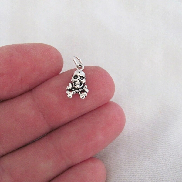 Very small Solid  Sterling Silver Skull and Crossbones mini tiny charm. (Brand new)