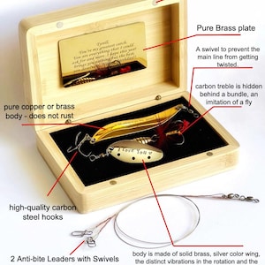 A bamboo fishing lure set presented in a box with magnets. The set includes brass lures, carbon steel hooks, and anti-bite leaders. The lures are designed for catching fish such as pike, bass, and walleye. The box also contains a card with text.