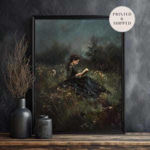 May include: A painting of a woman in a black dress sitting in a field of wildflowers and reading a book. The sky is a dark blue and the woman's hair is dark brown. The painting is framed in black.